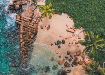 Seychelles drone shot of beach cliffs
